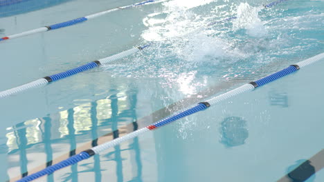 swimmer in action at a pool, with copy space