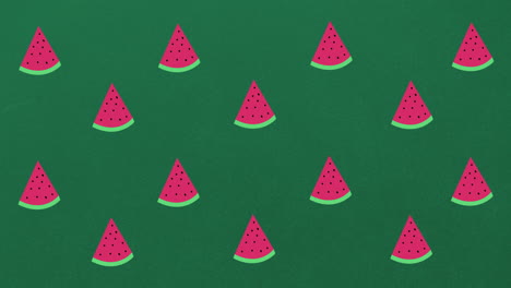 animación de sandías individuales flotando sobre un fondo verde
