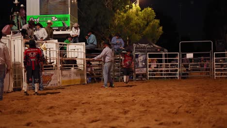 rodeo participants preparing for a bull riding event