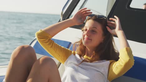 Side-view-of-a-teenage-Caucasian-girl-enjoying-her-time-on-a-boat