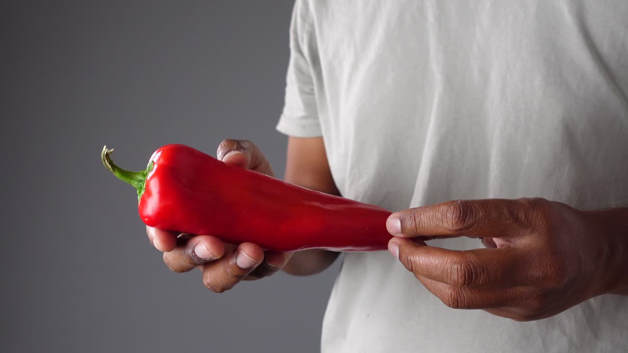 Red Bell Pepper held in hand