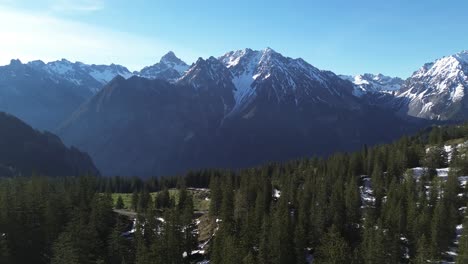 Aerial-Orbig-Landscape-shot-of-Austrian-Alps-surrounded-by-Mountains,-Europe