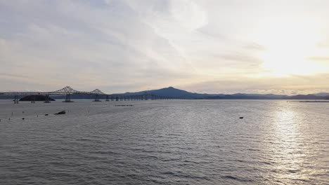 drone footage reveals the natural contours of point molate’s coast, with the richmond san rafael bridge in the distance.