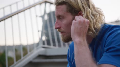 sporty caucasian man on a bridge