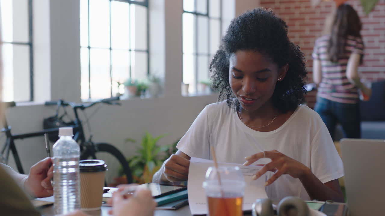 young diverse business people signing contract deal woman entrepreneur writing signature on legal document enjoying corporate partnership meeting in modern office