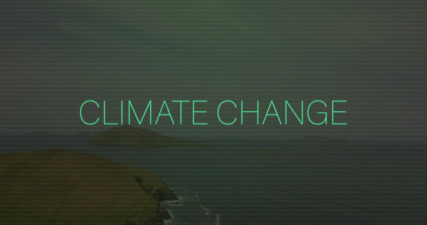 안개 낀 해안 위로 시안색 'CLIMATE CHANGE' 텍스트가 타이핑되고, 커서가 깜빡이며 오류가 발생하다가 안정되며 내용이 드러난다.