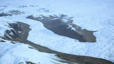 aerial view of glacier and mountains in arctic or antarctic