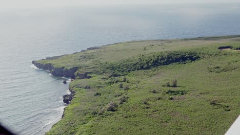 top view of an island from an airplane's window, pov