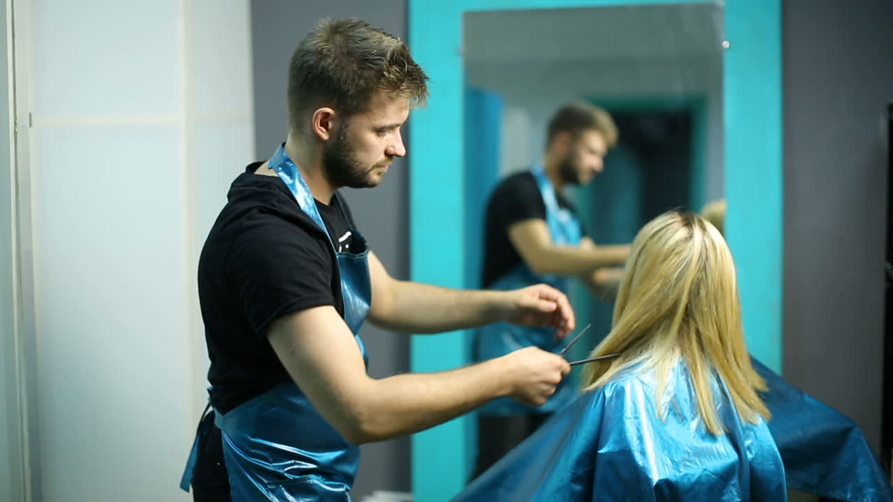 Woman cutting her hair in hairdresser salon