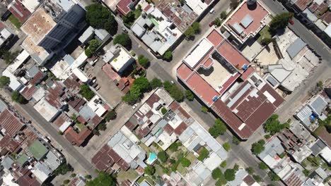 Top-down-drone-shots-flying-over-the-gridded-city-of-Gualeguaychú,-Entre-Ríos,-Argentina-on-a-sunyy-day