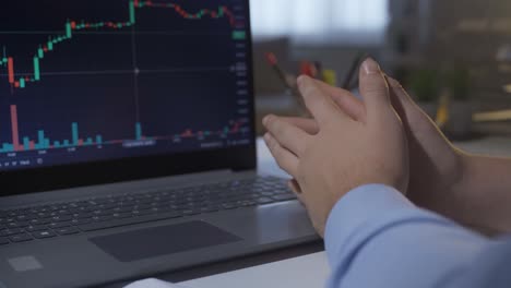 thoughtful hands analyzing charts in stock market.