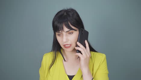 woman getting bad news on the phone gets upset.