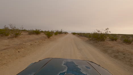 car driving along a mojave desert off-road trail - hyperlapse point of view