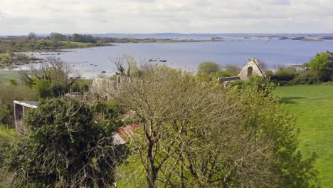 Picturesque-establishing-shot-of-Annaghdown-Abbey-ruins