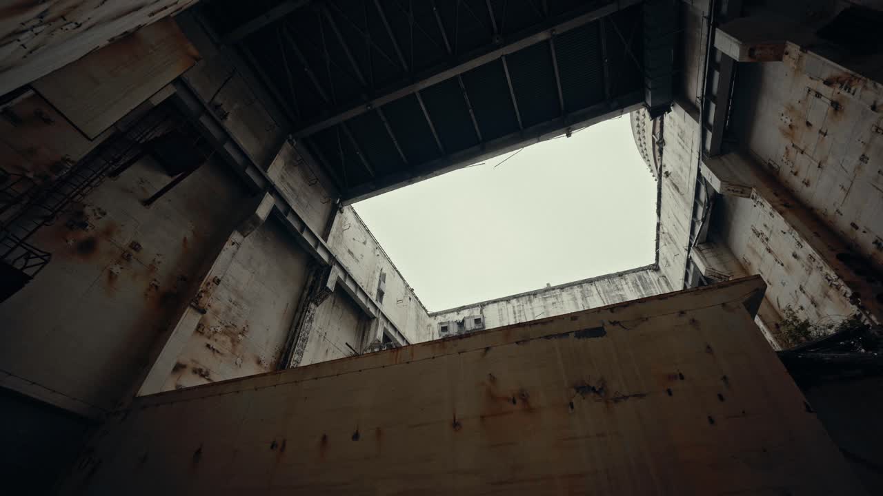 Upward Pan Inside a Large Abandoned Industrial Building