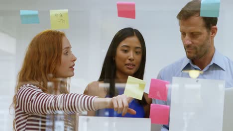 business colleagues discussing over sticky notes 4k