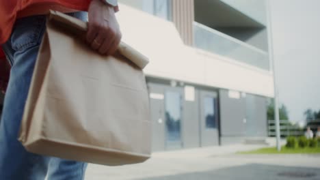 person walking with food delivery