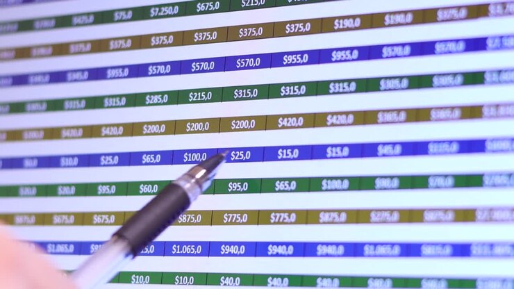 Businessman analyzes the stock market.