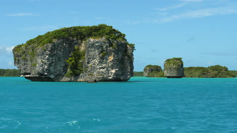 View-of-famous-floating-rocks-while-on-canoe-tour-in-Upi-Bay,-Isle-of-Pines