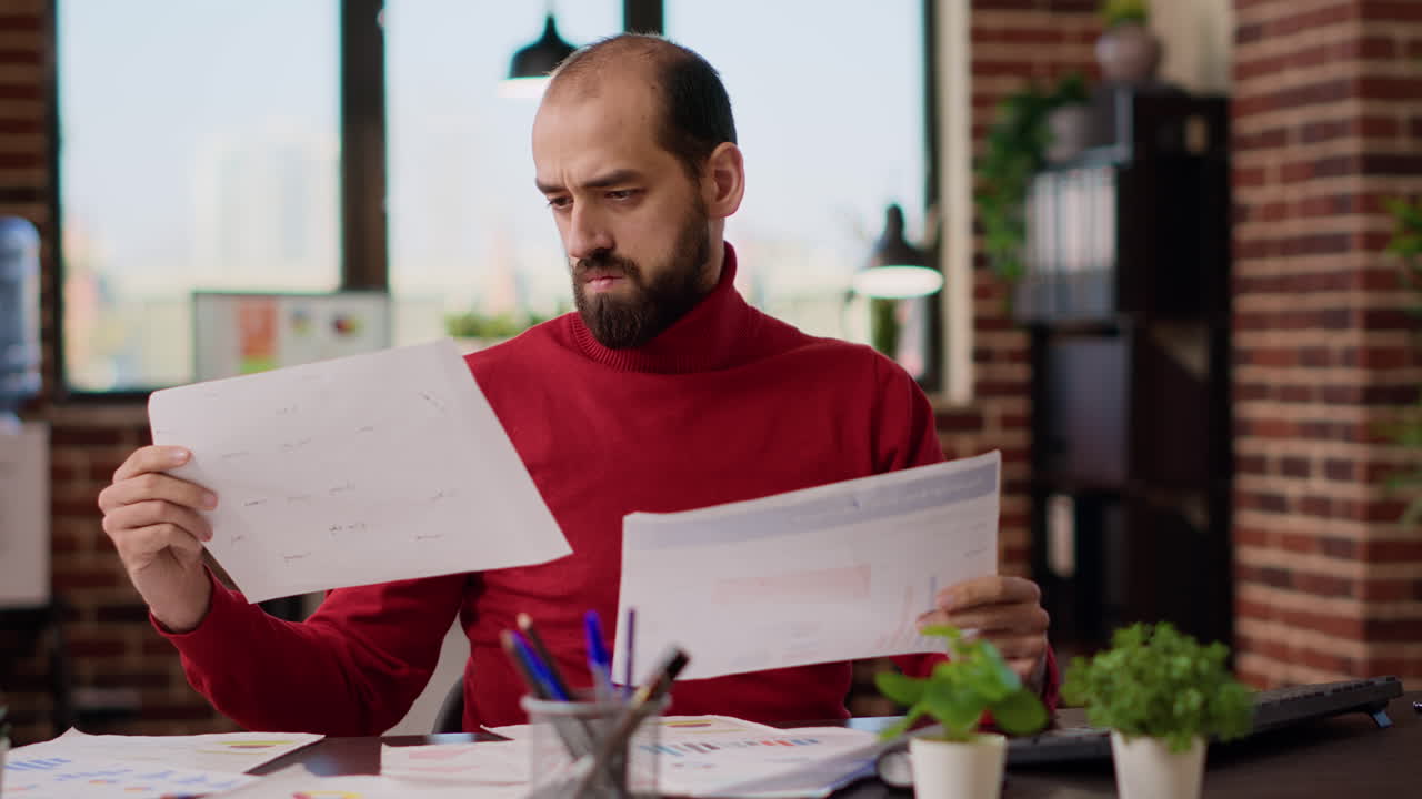 Project manager analyzing e commerce information on files