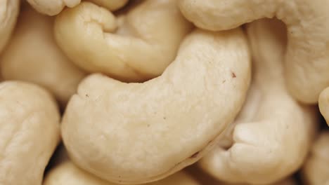 smooth camera movement over a handful of cashew nuts.