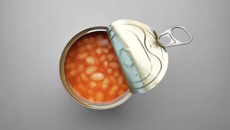 Preserved canned tomato beans in a tin container ,