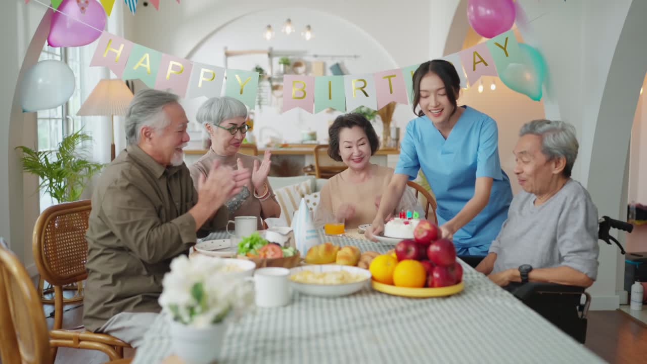 birthday party at senior daycare,group of asian female elder male female laugh smile positive conversation greeting in birthday friend party at nursing home senior daycare center Senior woman birthday