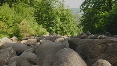 Felsenmeer-in-Odenwald-Sea-of-rocks-Wood-Nature-Tourism-on-a-sunny-day-steady-wide-shot