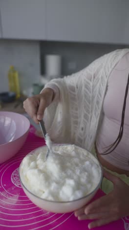 woman preparing egg whites for baking