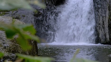 crystal cascades waterfall - water plunging and splashing on bottom of waterfall flowing into freshwater creek