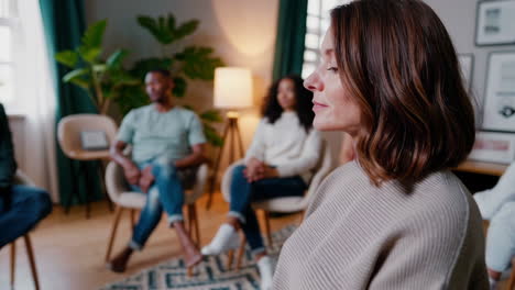 diverse group engaged in a therapy or support session