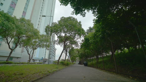 Shot-of-a-pedestrian-walkway-in-a-park-of-an-apartment-complex-in-Hong-Kong,-China