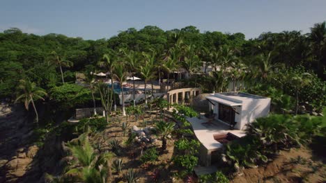 -Enchanting-aerial-view-reveals-a-luxurious-resort-nestled-along-captivating-shores-of-Huatulco