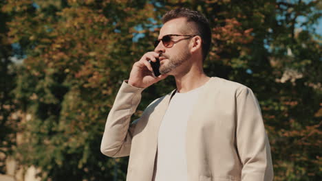 man using smartphone outdoors