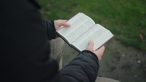 devout christian: opening and closing a holy bible