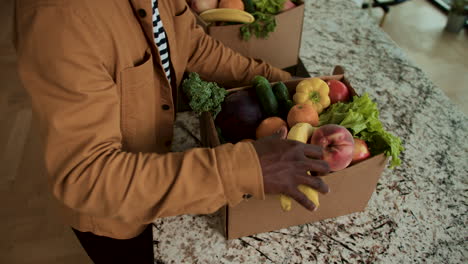 man unpacking groceries