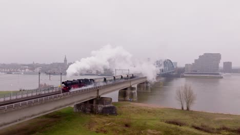 steam train in motion toward nijmegen – aerial perspective