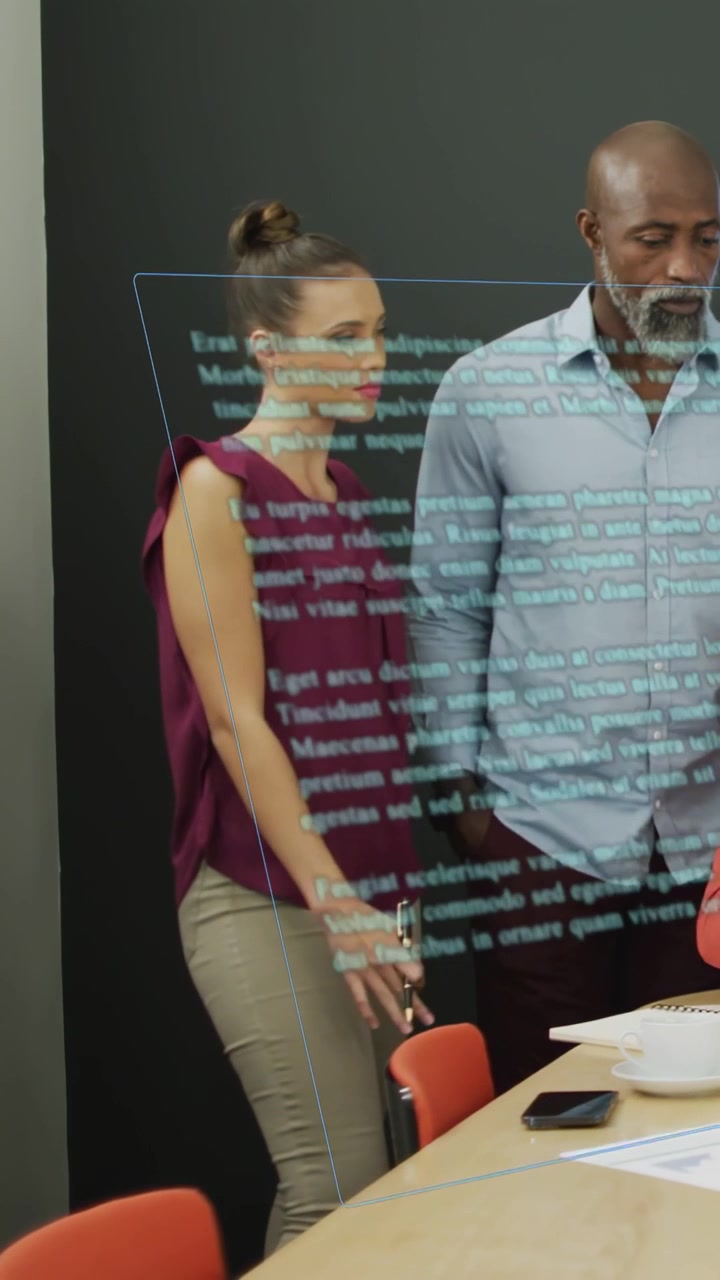 Vertical video: Woman tapping AR panel, swiping text and making business edits while man watches