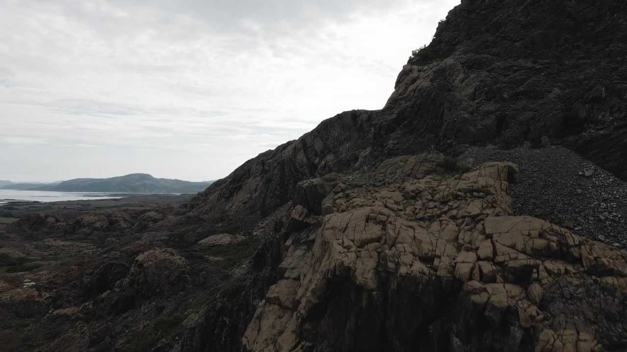 Rising over a rough rocky Leka Mountain in Norway -Aerial