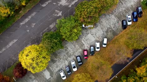 spinning zoom drone shot of a road and a parking lot