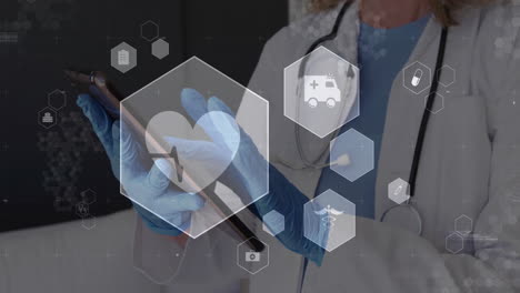 animation of medical icons over caucasian female doctor using tablet