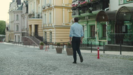 Businessman-walking-down-a-empty-street