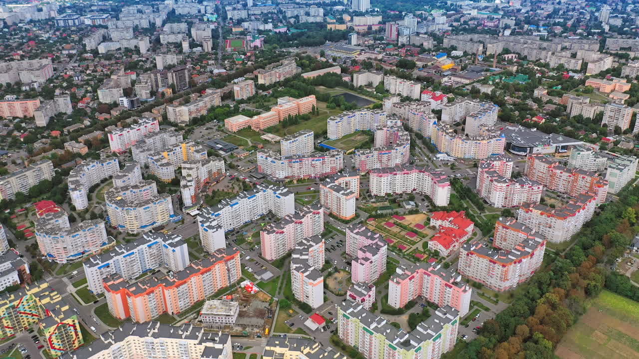 Contemporary district with multi-storey buildings. New apartment buildings of modern design. Residential landmarks in a new district of a city. Aerial view.