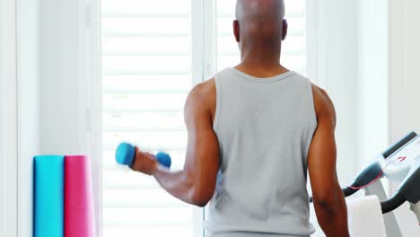 man exercising with dumbbells 4k