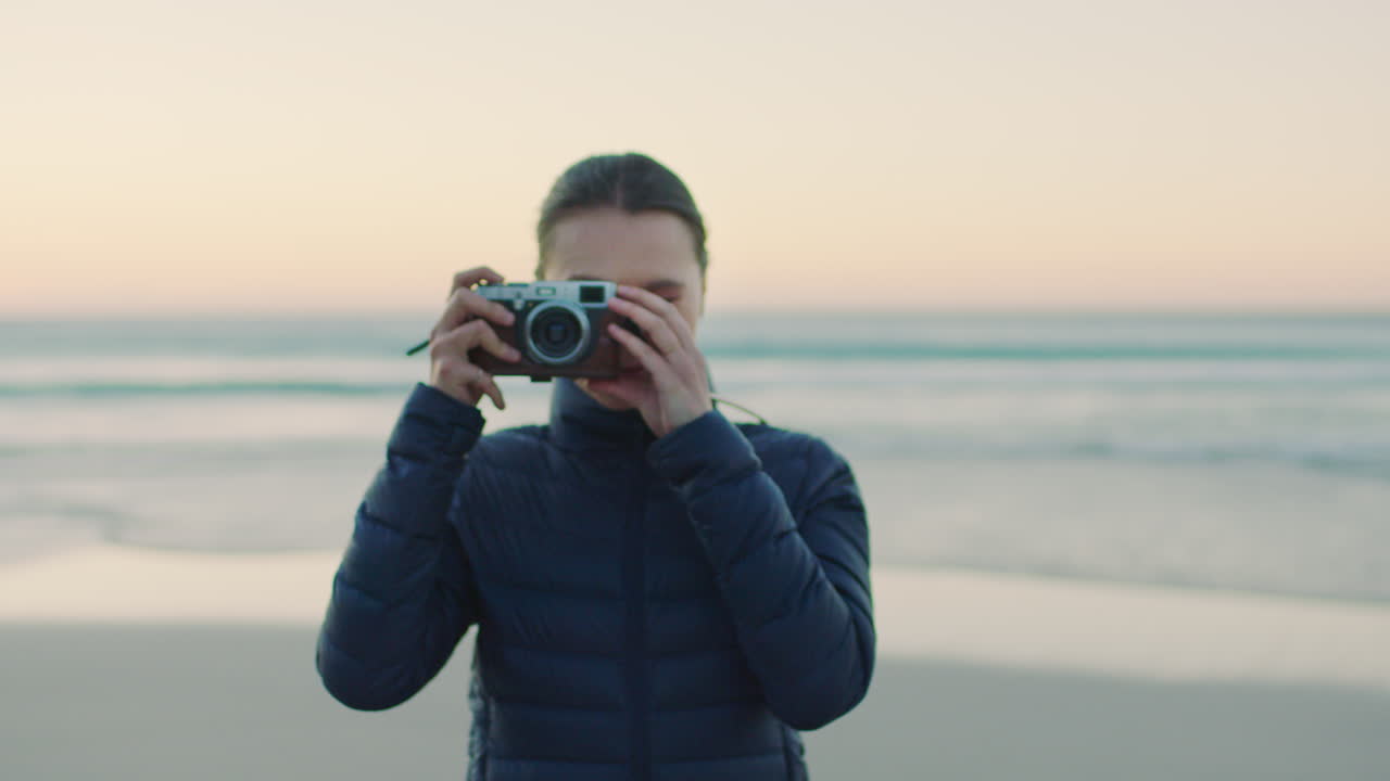 Photographer, portrait and woman at the beach