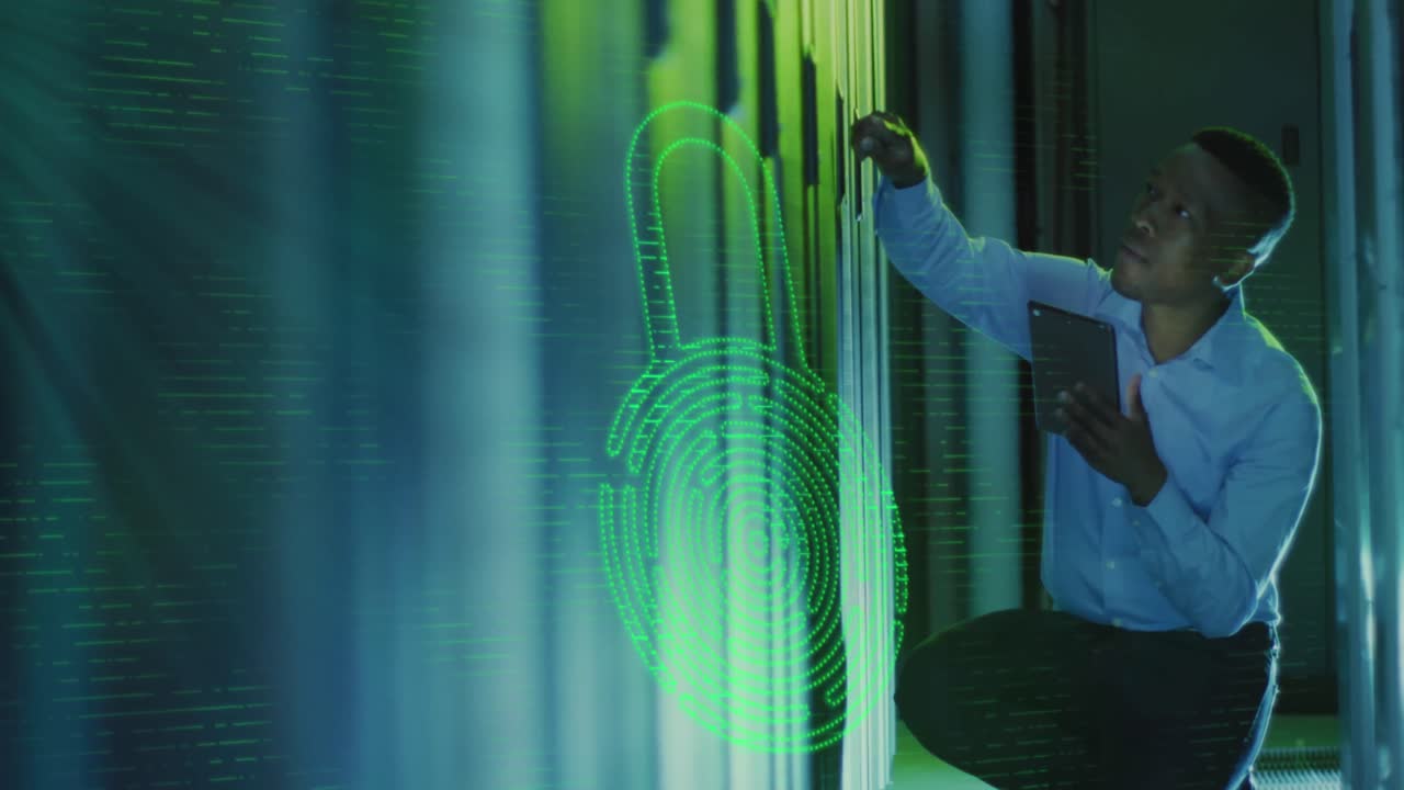 Animation of digital padlock over african american man working in server room