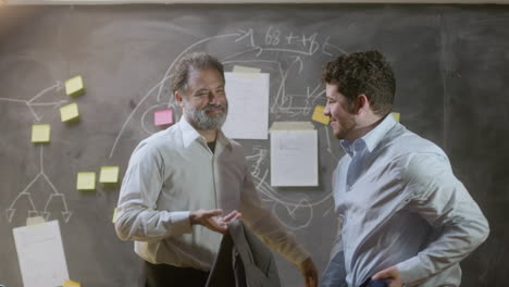 portrait shot of two successful businessmen standing