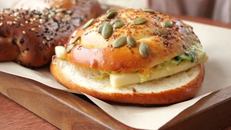 close up of a delicious sandwich with cheese and pumpkin seeds