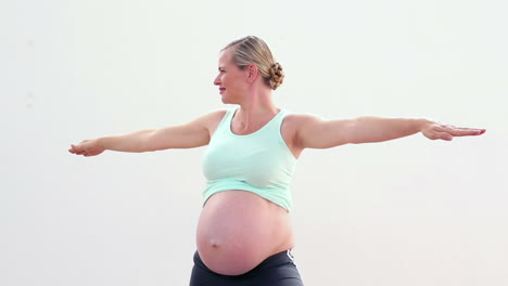 pregnant woman doing yoga