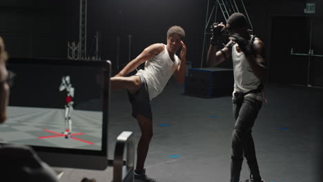 actor wearing motion capture suit rehearsing martial arts with instructor teaching fighting moves mo-cap suit for 3d character animation for virtual reality technology